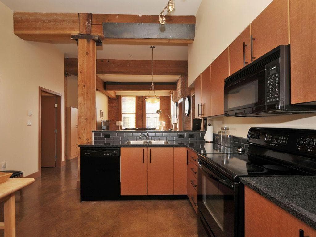 Historic Loft W Exposed Brick & Timber Beams