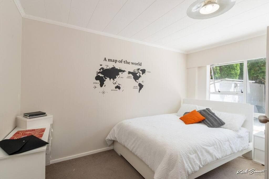 A modern 2 bedroom with private backyard, kitchen.