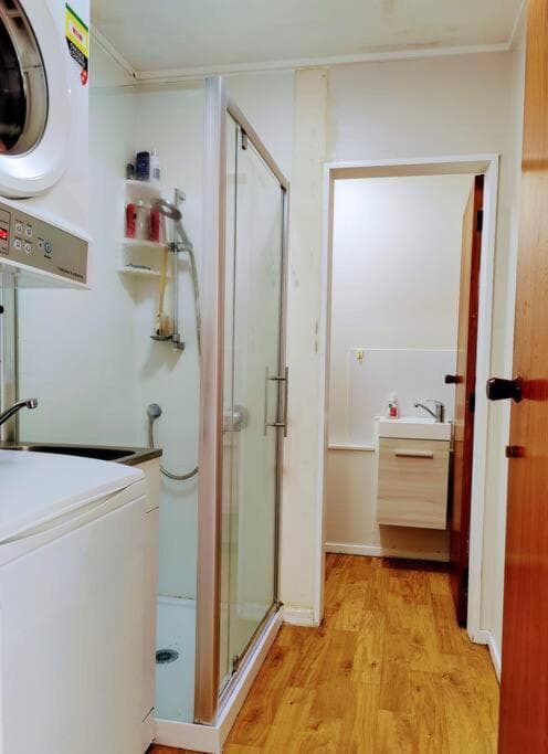 A modern 2 bedroom with private backyard, kitchen.